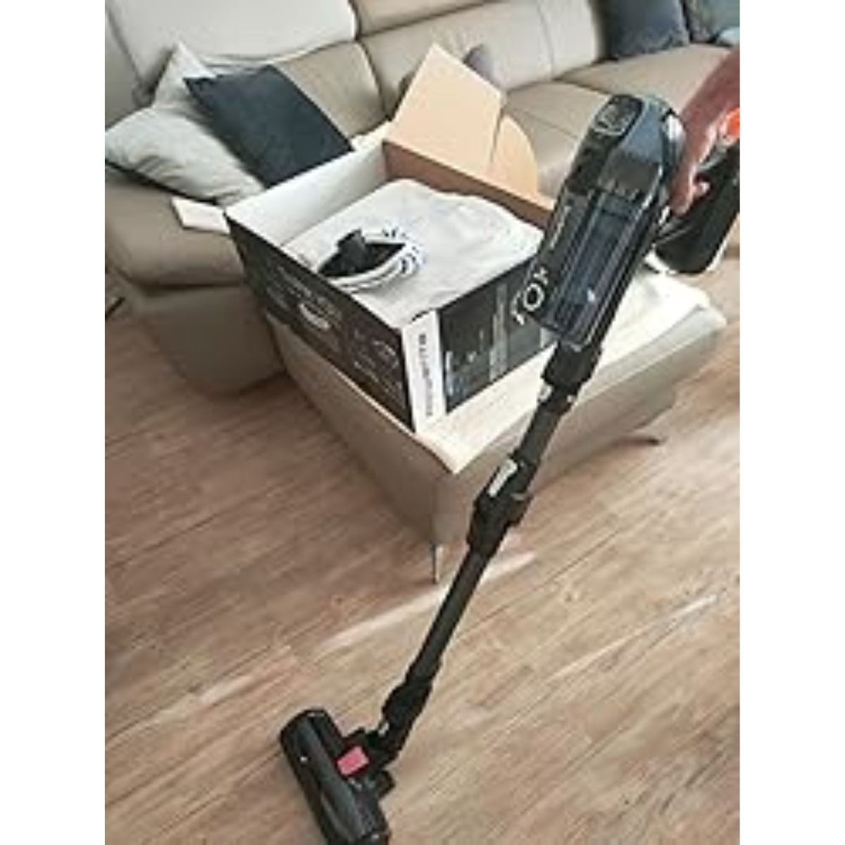 Cleaning under sofa with flex joint