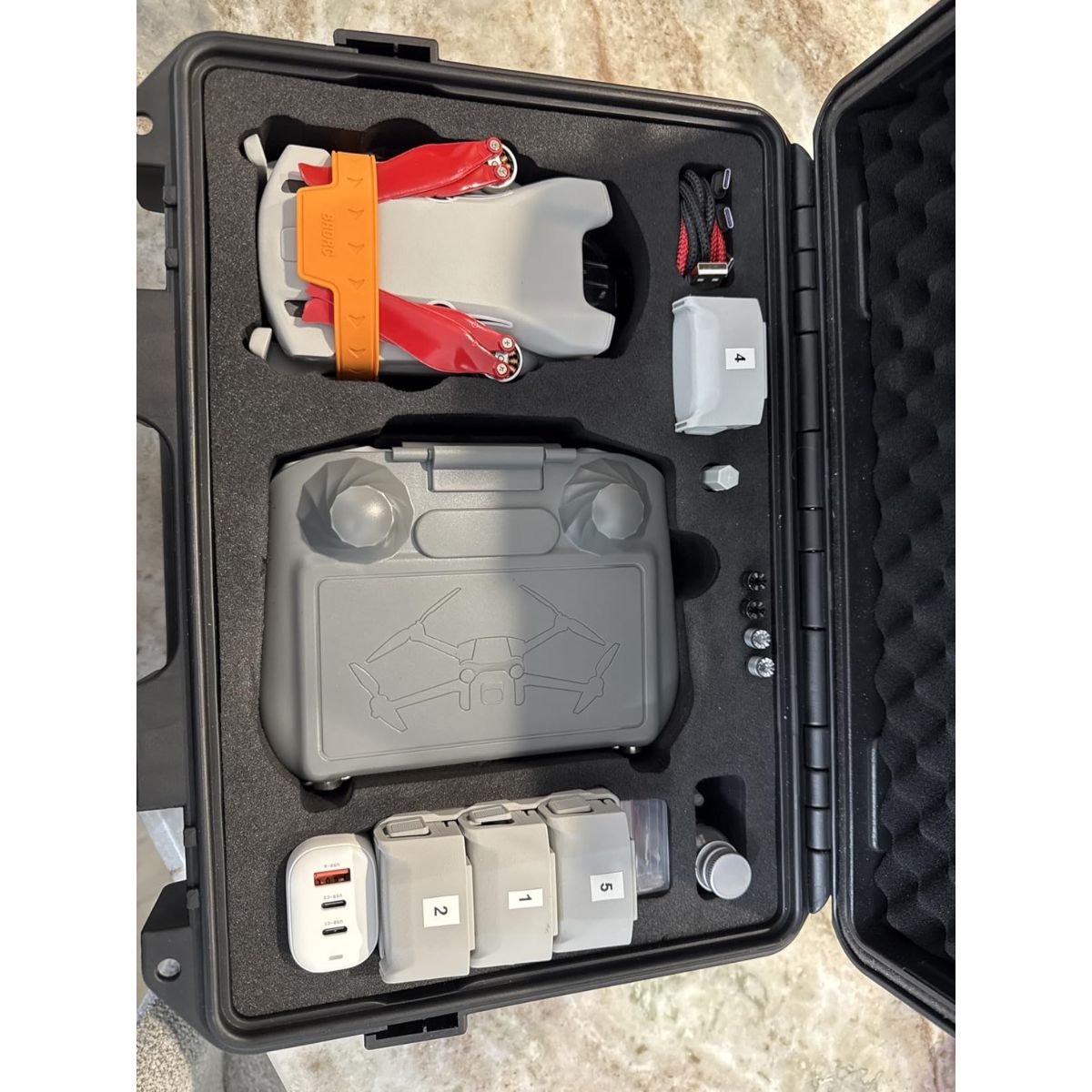 Holding folded drone in hand